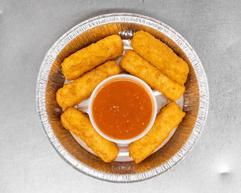Golden-brown mozzarella sticks arranged in a circle around a cup of marinara sauce in a foil container.